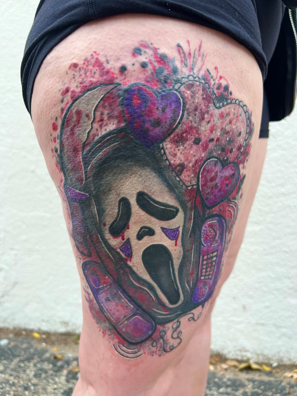 Purple ghost face from the movie, Scream, tattoo on a thigh with blood splatter watercolor.