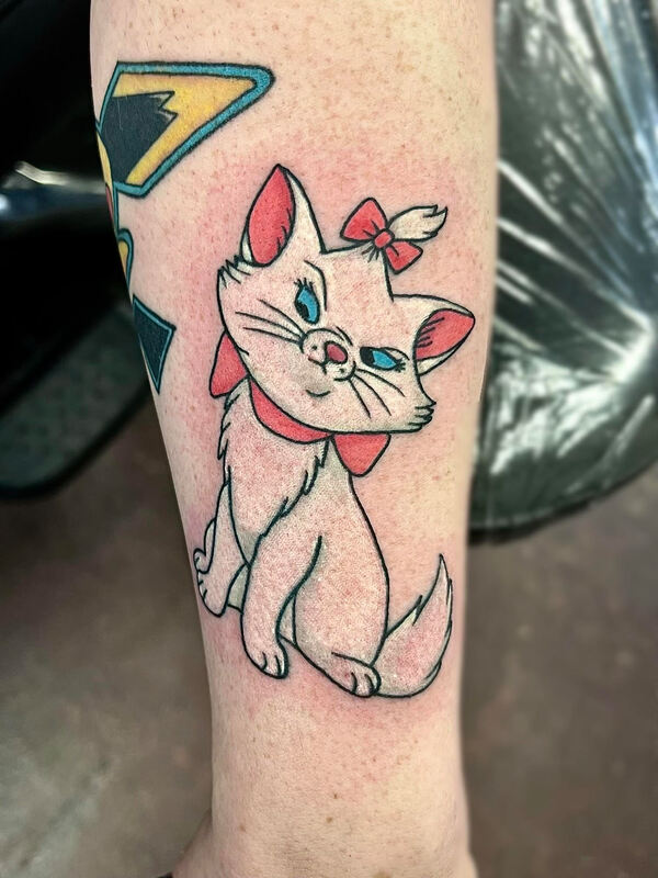 Marie from Aristocats with a grumpy face on a forearm.